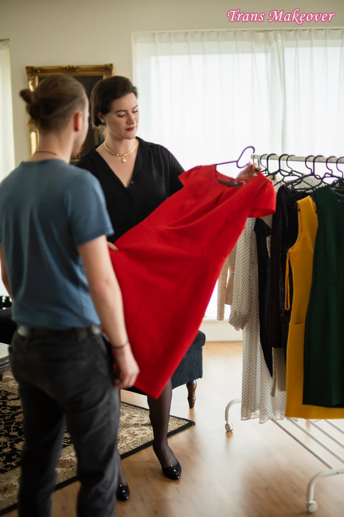 Lux selecting clothing for a Trans Makeover client